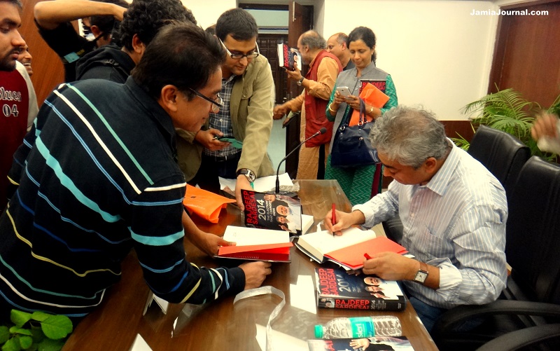 Rajdeep Sardesai signing his book at the launch of his book "2014: The Election that Changed India" held at Edward Said Hall, Jamia Millia Islamia; Thursday, Nov. 20, 2014 (Photo: Jamia Journal)